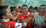 1 August 1999; Diarmuid Marsden of Armagh celebrates with supporters following the Bank of Ireland Ulster Senior Football Championship Final match between Armagh and Down at St Tiernach's Park at Clones in Monaghan. Photo by David Maher/Sportsfile