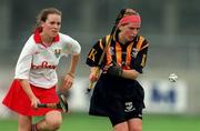 7 August 1999; Marina Downey of Kilkenny in action against Paula O'Connor of Cork during the Bórd na Gaeilge All Ireland Senior Camogie Championship Semi-Final match between Cork and Kilkenny at Parnell Park in Dublin. Photo by Ray McManus/Sportsfile