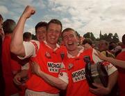 1 August 1999; John Rafferty of Armagh celebrates with teammates following the Ulster Senior Football Championship Final match between Armagh and Down at St Tiernach's Park at Clones in Monaghan. Photo by David Maher/Sportsfile
