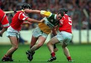 8 August 1999; John Ryan of Offaly is tackled by Brian Corcoran, left, and Wayne Sherlock of Cork during the Guinness All-Ireland Hurling Senior Championship Semi-Final match between Cork and Offaly at Croke Park in Dublin. Photo by Brendan Moran/Sportsfile