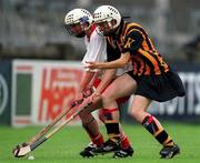 7 August 1999; Kelly Long of Kilkenny in action against Sarah Hayes of Cork during the Bórd na Gaeilge All Ireland Senior Camogie Championship Semi-Final match between Cork and Kilkenny at Parnell Park in Dublin. Photo by Ray McManus/Sportsfile