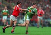 18 July 1999; Killian Burns of Kerry in action against Don Davisduring of Cork during the Bank of Ireland Munster GAA Football Championship Final match between Cork and Kerry at Páirc Uí Chaoimh in Cork. Photo by Brendan Moran/Sportsfile