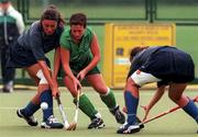 8 August 1999; Kim Mills of Ireland in action against Caroline Delloye, left, and Christelle Lafaury of France during the International women's hockey match between Ireland and France at UCD in Dublin. Photo by Matt Browne/Sportsfile