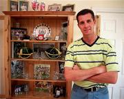 22 July 1999; Liam O'Brien pictured beside a cabinet with some of his medals and International caps at his home in Kill, Kildare. Photo by Brendan Moran/Sportsfile