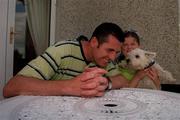 22 July 1999. Liam O'Brien pictured with his daughter Lauren and dog Chandler at his home in Kill, Kildare. Photo by Brendan Moran/Sportsfile