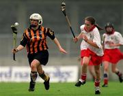7 August 1999; Lizzie Lyng of Kilkenny in action against Paula O'Connor of Cork during the Bórd na Gaeilge All Ireland Senior Camogie Championship Semi-Final match between Cork and Kilkenny at Parnell Park in Dublin. Photo by Ray McManus/Sportsfile