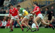 9 April 1995; Michael Duignan of Offaly in action against Alan Browne of Cork during the Church & General National Hurling League Quarter Final match between Offaly and Cork at Semple Stadium in Thurles, Tipperary. Photo by Ray McManus/Sportsfile