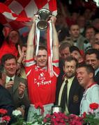 18 July 1999; Cork captain Philip Clifford lifts the cup after his side defeated Kerry during the Bank of Ireland Munster GAA Football Championship Final match between Cork and Kerry at Páirc Uí Chaoimh in Cork. Photo by Brendan Moran/Sportsfile