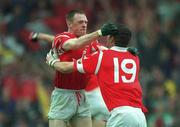 18 July 1999; Philip Clifford of Cork congratulates his team-mate Fachtna Collins after scoring his side's first goal during the Bank of Ireland Munster GAA Football Championship Final match between Cork and Kerry at Páirc Uí Chaoimh in Cork. Photo by Brendan Moran/Sportsfile