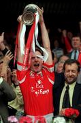 18 July 1999; Cork captain Philip Clifford lifts the cup after the game during the Bank of Ireland Munster GAA Football Championship Final match between Cork and Kerry at Páirc Uí Chaoimh in Cork. Photo by Brendan Moran/Sportsfile