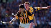 15 August 1999; Phil Larkin of  Kilkenny in action against Niall Gilligan of Clare during the Guinness All-Ireland Senior Hurling Championship Semi-Final match between Kilkenny and Clare at Croke Park in Dublin. Photo by Ray McManus/Sportsfile