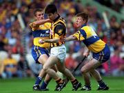 15 August 1999; Philip Larkin of Kilkenny in action against Alan Markham, left, and Niall Gilligan of Clare during the Guinness All-Ireland Senior Hurling Championship Semi-Final match between Kilkenny and Clare at Croke Park in Dublin. Photo by Brendan Moran/Sportsfile