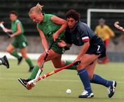 8 August 1999; Rachael Kohler of Ireland in action against Murieln Lazennec of France during the International women's hockey match between Ireland and France at UCD in Dublin. Photo by Matt Browne/Sportsfile