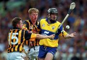 15 August 1999; Sean McMahon of Clare is tackled by Charlie Carter, 15, and John Power of Kilkenny during the Guinness All-Ireland Senior Hurling Championship Semi-Final match between Kilkenny and Clare at Croke Park in Dublin. Photo by Brendan Moran/Sportsfile