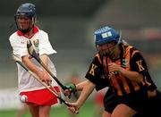 7 August 1999; Sinead O'Callaghan of Cork, has her shot blocked by Kilkenny's Tracey Millea and Margaret Hickey,hidden, during the Bórd na Gaeilge All Ireland Senior Camogie Championship Semi-Final match between Cork and Kilkenny at Parnell Park in Dublin. Photo by Ray McManus/Sportsfile