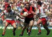 11 July 1999; Mickey Linden of Down in action against Paul McGurk, right, and Ciaran Gourley of Tyrone during the Bank of Ireland Ulster Football Championship Semi Final match between Down and Tyrone at Casement Park in Belfast, Antrim. Photo by Matt Browne/Sportsfile