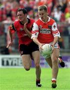 1 August 1999; Paddy McKeever of Armagh in action against Simon Poland of Down during the Bank of Ireland Ulster Senior Football Championship Final match between Armagh and Down at St Tiernach's Park at Clones in Monaghan. Photo by David Maher/Sportsfile