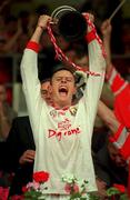 18 July 1999; Cork minor captain Patrick O'Shea lifts the cup after the Munster GAA Football Minor Championship Final match between Cork and Kerry at Páirc Uí Chaoimh in Cork. Photo by Brendan Moran/Sportsfile