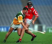 8 August 1999; Paudie Mulhare of Offaly in action against Brian Corcoran of Cork during the Guinness All-Ireland Hurling Senior Championship Semi-Final match between Cork and Offaly at Croke Park in Dublin. Photo by Ray McManus/Sportsfile