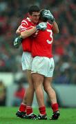 18 July 1999; Tom Kenny of Cork and team-mate Noel Furlong celebrate after the final whistle during the Munster GAA Football Minor Championship Final match between Cork and Kerry at Páirc Uí Chaoimh in Cork. Photo by Brendan Moran/Sportsfile