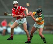 8 August 1999; Timmy McCarthy of Cork in action against  Hubert Rigney of Offaly during the Guinness All-Ireland Hurling Senior Championship Semi-Final match between Cork and Offaly at Croke Park in Dublin. Photo by Ray McManus/Sportsfile
