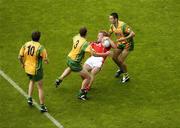 5 August 2006; Anthony Lynch, Cork, iis tackled by Donegal players Rory Kavanagh, who was booked, Eamonn McGee, 3, and Christy Toye, 10. Bank of Ireland All-Ireland Senior Football Championship Quarter-Final, Cork v Donegal, Croke Park, Dublin. Picture credit; Ray McManus / SPORTSFILE