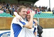 6 August 2006; Laois manager Pat Critchley, left, celebrates his team's victory with Lulu Carroll, Selector, after the final whistle. TG4 Ladies Leinster Senior Football Final, Meath v Laois, Dr. Cullen Park, Carlow. Picture credit; Ray Lohan / SPORTSFILE *** Local Caption ***