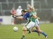 6 August 2006; Tracey Lawlor, Laois, in action against Geraldine Doherty, Meath. TG4 Ladies Leinster Senior Football Final, Meath v Laois, Dr. Cullen Park, Carlow. Picture credit; Ray Lohan / SPORTSFILE
