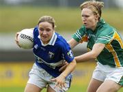 6 August 2006; Gemma O'Connor, Laois, in action against Suzanne McCormack, Meath. TG4 Ladies Leinster Senior Football Final, Meath v Laois, Dr. Cullen Park, Carlow. Picture credit; Ray Lohan / SPORTSFILE