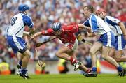 6 August 2006; Ronan Curran, Cork, prepares to clear under pressure from Paul Flynn, 18, and Eoin Kelly, Waterford. Guinness All-Ireland Senior Hurling Championship Semi-Final, Cork v Waterford, Croke Park, Dublin. Picture credit; Ray McManus / SPORTSFILE