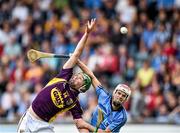 9 July 2014: Conor McDonald, Wexford, in action against Cian O'Callaghan, Dublin. Bord Gais Energy Leinster GAA Hurling Under 21 Championship Final, Dublin v Wexford. Parnell Park, Dublin. Picture credit: David Maher / SPORTSFILE