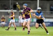 9 July 2014: Jack Guiney, Wexford, in action against Eoghan O'Donnell, Dublin. Bord Gais Energy Leinster GAA Hurling Under 21 Championship Final, Dublin v Wexford, Parnell Park, Dublin. Picture credit: David Maher / SPORTSFILE