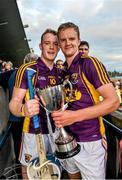 9 July 2014: Wexford captain Shane O'Gorman, right, celebrates with team-mate Jack Guiney and the cup after the game. Bord Gais Energy Leinster GAA Hurling Under 21 Championship Final, Dublin v Wexford, Parnell Park, Dublin. Picture credit: David Maher / SPORTSFILE