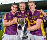 9 July 2014: Wexford captain Shane O'Gorman, centre, celebrates with team-mates Jack Guiney, right, and Tony French and the cup after the game. Bord Gais Energy Leinster GAA Hurling Under 21 Championship Final, Dublin v Wexford, Parnell Park, Dublin. Picture credit: David Maher / SPORTSFILE