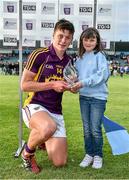 9 July 2014: Conor McDonald, Wexford, is presented with the Bord Gáis Energy Player of the Match by Carla Connolly, age 8, from Castlerea, Co. Roscommon. Bord Gais Energy Leinster GAA Hurling Under 21 Championship Final, Dublin v Wexford, Parnell Park, Dublin. Picture credit: Brendan Moran / SPORTSFILE