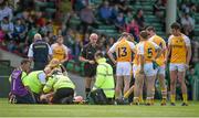 5 July 2014; Justin Crozier, Antrim, is attended to my medical personnel before being carried from the pitch on a stretcher, which led to a 10 minute delay in the game. GAA Football All-Ireland Senior Championship, Round 2, Limerick v Antrim, Gaelic Grounds, Limerick. Picture credit: Brendan Moran / SPORTSFILE