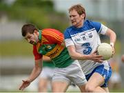 28 June 2014; Liam Ó Lionáin, Waterford, in action against Daniel St Ledger, Carlow. GAA Football All Ireland Senior Championship, Round 1B, Carlow v Waterford. Dr. Cullen Park, Carlow. Picture credit: Piaras Ó Mídheach / SPORTSFILE