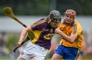 12 July 2014; Liam Og McGovern, Wexford, is tackled by Jack Browne, Clare. GAA Hurling All-Ireland Senior Championship Round 1 Replay, Clare v Wexford, Wexford Park, Wexford. Picture credit: Ray McManus / SPORTSFILE