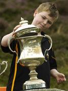 5 August 2006; Cathal Hamilton, age 10, from Blackrock, Co. Louth, puts the lid on the cup. M Donnelly All-Ireland Poc Fada Final, Annaverna Mountain, Ravensdale, Co Louth. Picture credit; Brian Lawless / SPORTSFILE