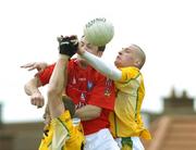 12 August 2006; Martin Farrelly, Louth, in action against Joseph Quinn, left and Kevin McGourty, Antrim. Tommy Murphy Cup, Semi-Final, Louth v Antrim, St. Brigid's Park, Dowdallshill, Dundalk, Co. Louth. Picture credit; Ray Lohan / SPORTSFILE *** Local Caption ***