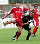 12 August 2006; Colm Kearney, Larne, in action against Tim McCann, Linfield. CIS Insurance Cup, Larne v Linfield, Inver Park, Larne, Co. Antrim. Picture credit: Oliver Mc Veigh / SPORTSFILE