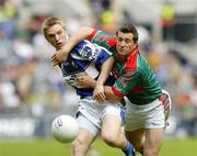 13 August 2006; Ross Munnelly, Laois, in action against Dermot Geraghty, Mayo. Bank of Ireland All-Ireland Senior Football Championship Quarter-Final, Mayo v Laois, Croke Park, Dublin. Picture credit; Damien Eagers / SPORTSFILE