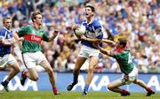 13 August 2006; Brendan Quigley, Laois, in action against Ronan McGarrity, left, and Keith Higgins, Mayo. Bank of Ireland All-Ireland Senior Football Championship Quarter-Final, Mayo v Laois, Croke Park, Dublin. Picture credit; Damien Eagers / SPORTSFILE