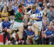 13 August 2006; Ross Munnelly, Laois, in action against Dermot Geraghty, Mayo. Bank of Ireland All-Ireland Senior Football Championship Quarter-Final, Mayo v Laois, Croke Park, Dublin. Picture credit; Ray McManus / SPORTSFILE