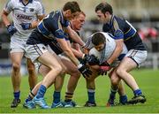 12 July 2014; Robbie Kehoe, Laois, in action against Tipperary players, from left, Conor Sweeney, George Hannigan and Barry Grogan. GAA Football All-Ireland Senior Championship Round 3A, Laois v Tipperary. O'Moore Park, Portlaoise, Co. Laois. Picture credit: Piaras Ó Mídheach / SPORTSFILE