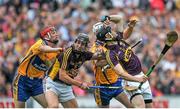 12 July 2014; Liam Óg McGovern, left, and PJ Nolan, Wexford, in action against Jack Browne, left, and Patrick O'Connor, Clare. GAA Hurling All-Ireland Senior Championship Round 1 Replay, Clare v Wexford, Wexford Park, Wexford. Picture credit: Dáire Brennan / SPORTSFILE