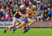 12 July 2014; Aaron Cunningham, Clare, is tackled by Matthew O'Hanlon, behind, and Liam Ryan, Wexford, during the second half of extra time. GAA Hurling All-Ireland Senior Championship Round 1 Replay, Clare v Wexford, Wexford Park, Wexford. Picture credit: Ray McManus / SPORTSFILE