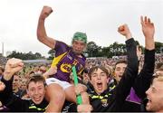 12 July 2014; Wexford's Conor McDonald is carried shoulder-high off the pitch by supporters after the final whistle. GAA Hurling All-Ireland Senior Championship Round 1 Replay, Clare v Wexford, Wexford Park, Wexford. Picture credit: Ray McManus / SPORTSFILE
