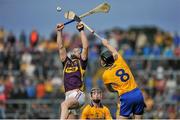 12 July 2014; Jack Guiney, Wexford, in action against Patrick Donnellan, Clare. GAA Hurling All-Ireland Senior Championship Round 1 Replay, Clare v Wexford, Wexford Park, Wexford. Picture credit: Dáire Brennan / SPORTSFILE