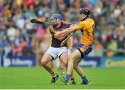 12 July 2014; Ian Byrne, Wexford, in action against Patrick Donnellan, Clare. GAA Hurling All-Ireland Senior Championship Round 1 Replay, Clare v Wexford, Wexford Park, Wexford. Picture credit: Dáire Brennan / SPORTSFILE